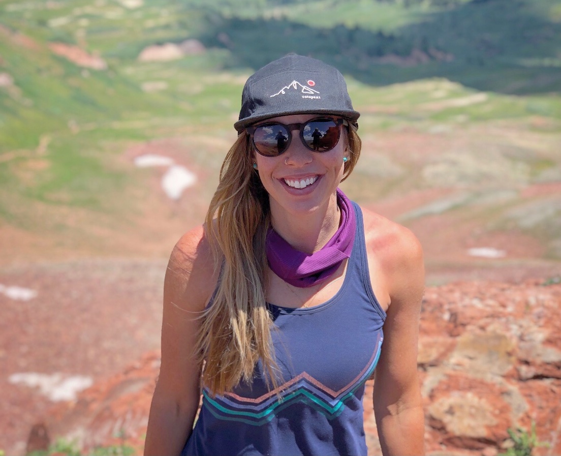 Cairn Project Ambassador Teagan Papke smiles while hiking
