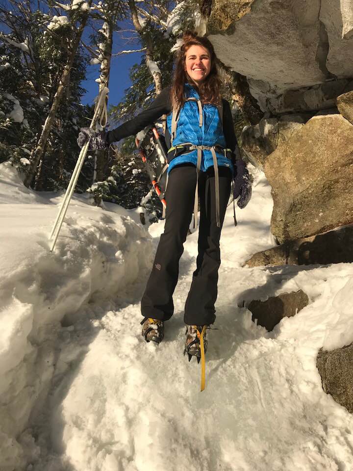 Lucia Tonachel standing on a glacier wearing crampons
