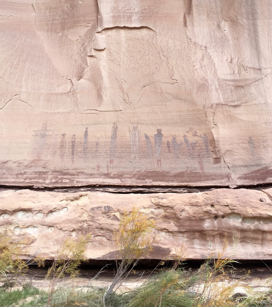 petroglyphs on the side of a canyon wall